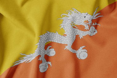 Dokulu Kumaş Arkaplanı Ulusal Bayrağı. İpek desenli bayrak, gerçekçi dalga ve bayrak görünümü. Bhutan Bayrakları