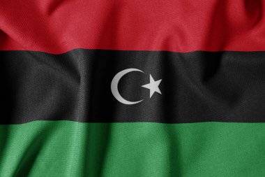 Dokulu Kumaş Arkaplanı Ulusal Bayrağı. İpek desenli bayrak, gerçekçi dalga ve bayrak görünümü. LY Libya Bayrağı