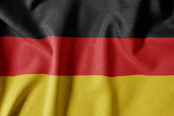 Dokulu Kumaş Arkaplanı Ulusal Bayrağı. İpek desenli bayrak, gerçekçi dalga ve bayrak görünümü. Almanya Bayrağı