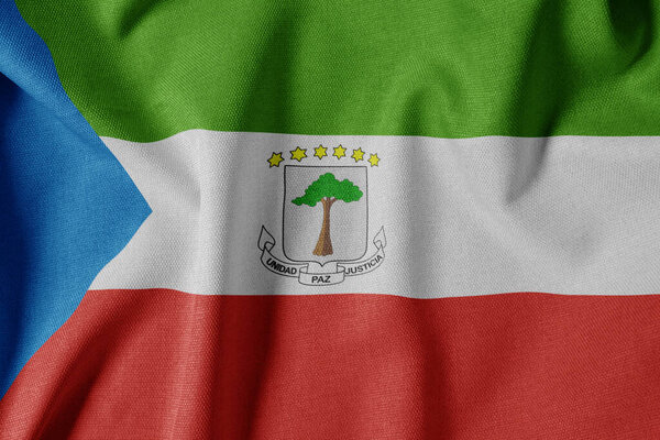 National Flag on Textured Fabric Background. Silk textured flag, realistic wave and flag look. GQ  Flag of Equatorial Guinea
