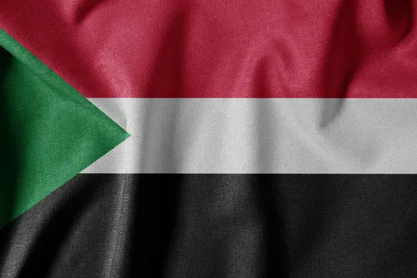 Dokulu Kumaş Arkaplanı Ulusal Bayrağı. İpek desenli bayrak, gerçekçi dalga ve bayrak görünümü. SD Sudan Bayrağı