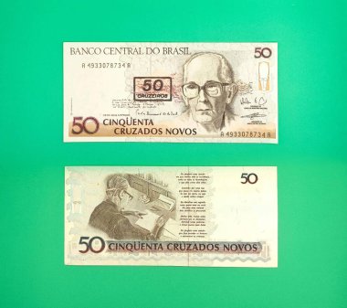 Brezilya Merkez Bankası 'ndan yeni 50 cruzado banknotları, canlı yeşil arkaplana sahip insan ve tasarım elemanlarının resimlerini içeriyor, ülkenin ekonomi ve finans tarihini sembolize ediyor..