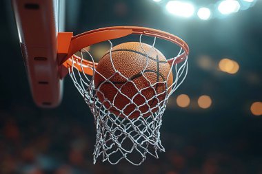 Basketbol topu, topun, ağın ve basketbol potasının net dokusunun içinden bir basketbol potasının arka planına doğru mükemmel bir anda geçiyor..