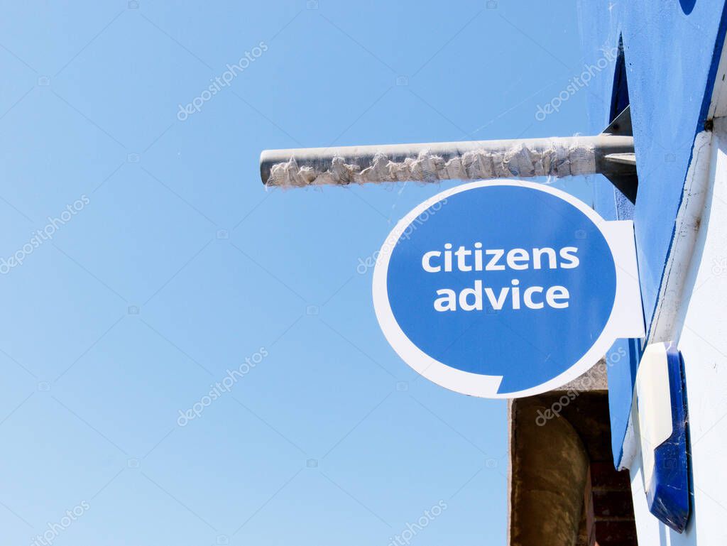 Cambridge, Cambridgeshire / United Kingdom - May 11th 2025: Citizens Advice sign in Cambridge, United Kingdom. Blue sign, blue sky, no people.