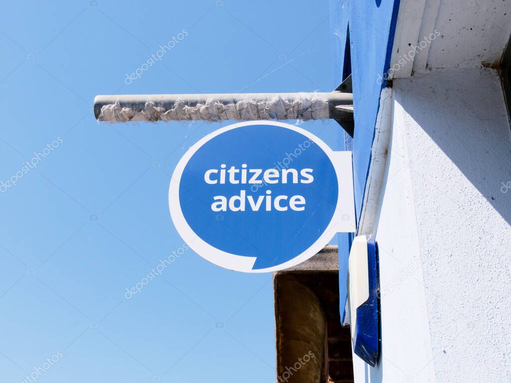 Cambridge, Cambridgeshire / United Kingdom - May 11th 2025: Citizens Advice sign in Cambridge, United Kingdom. Blue sign, blue sky, no people.