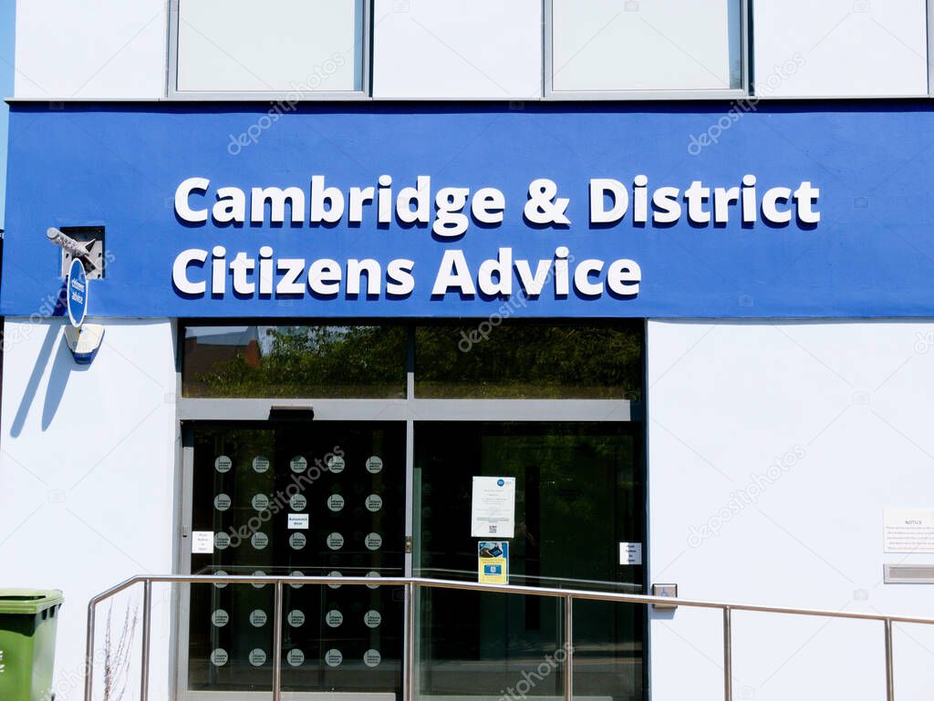 Cambridge, Cambridgeshire / United Kingdom - May 11th 2025: Citizens Advice sign in Cambridge, United Kingdom. Blue sign, blue sky, no people.