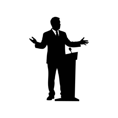 Podyumda uzanmış elleriyle konuşma yapan bir adamın silüeti.