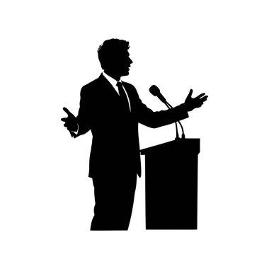 Podyumda mikrofonla konuşan bir adamın silueti.