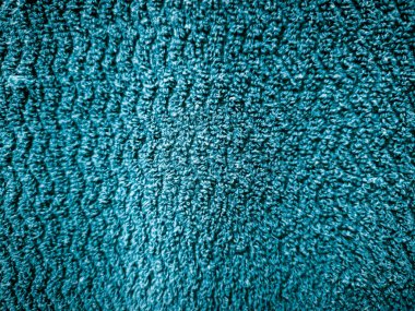 Yumuşak desenli turkuaz havlu kumaş arka planı.