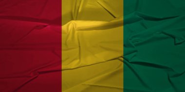 Açık Mavi Gökyüzüne Karşı Rüzgarda Dalgalanan Gine Bayrağı