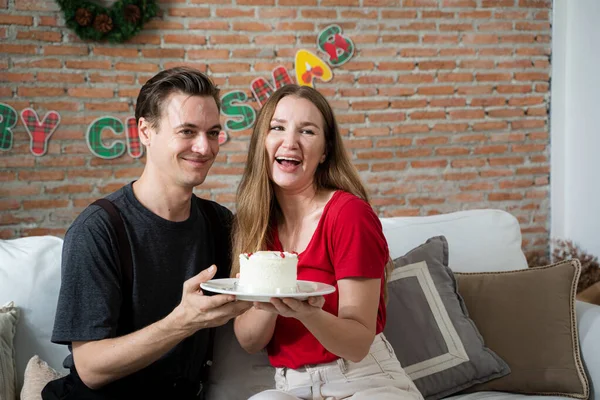 Wife birthday,husband surprise his wife with birthday cake,Anniversary,Couple celebrating holding a birthday cake.