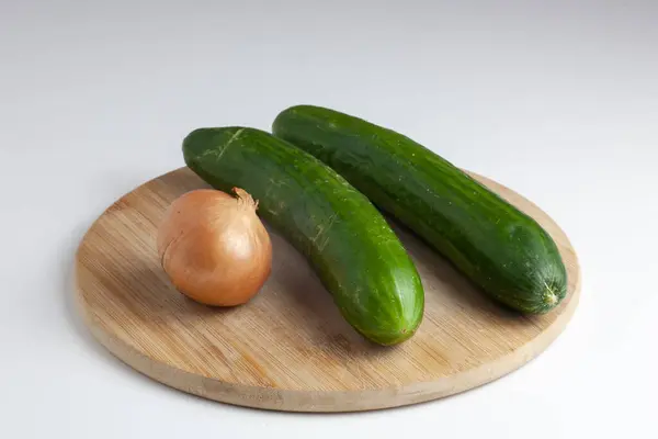 Two Cucumbers Onion Table White Background — Stock Photo, Image