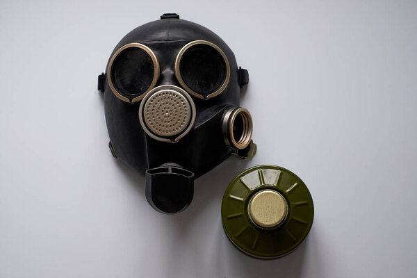 There is a gas mask on the table. On a white background.