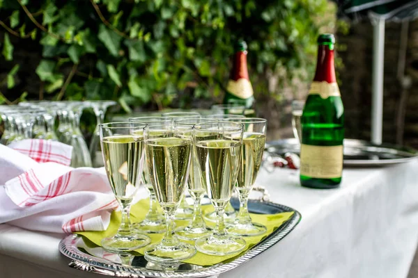 sparkling wine in glasses in restaurant or on a party wedding dinner setting.