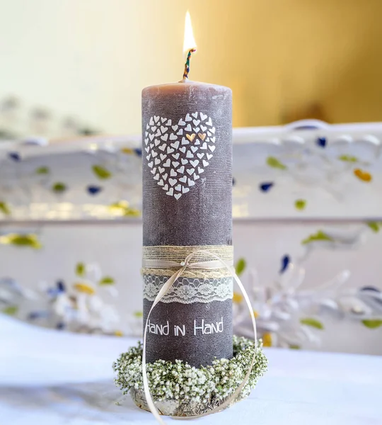 The wedding candle for the bride and groom. candle is the family hearth symbol at a wedding.