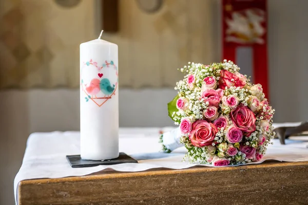 The wedding candle for the bride and groom. candle is the family hearth symbol at a wedding.