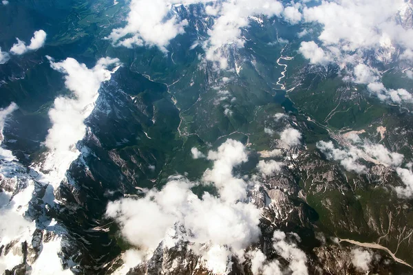 Beautiful Window View Fluffy Clouds Alps Mountains Passenger Seat Airplane Royalty Free Stock Images