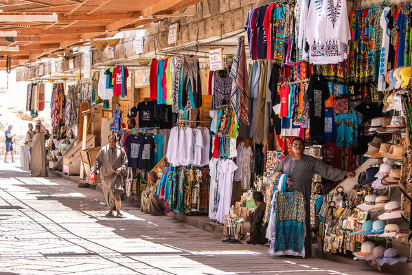 Luxor, EGYPT 18.05.2018 Traditional egyptian colorful palatine and clothes sold at open air market at Temple Hatschepsut.