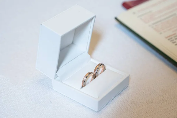 Romantic marriage couple wedding Symbols rings in a white box on a table.