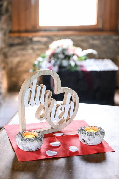 Wedding wood sign LOVE Heart, Text in German YOU and Me for Background photo with candles.