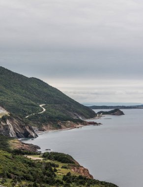 A panoramic view of the Cape Breton Island Coast line cliff scenic Cabot Trail route, Nova Scotia Hghlands Canada. clipart