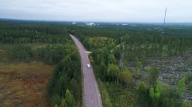 Caravan Camping driving on E45 Highway Road through the wilderness of middle Sweden between the towns of Malung and Oje.