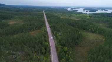 Caravan Camping driving on E45 Highway Road through the wilderness of middle Sweden between the towns of Malung and Oje.