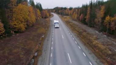 Caravan Camping driving on E45 Highway Road through the wilderness of middle Sweden near the town Lomsele.