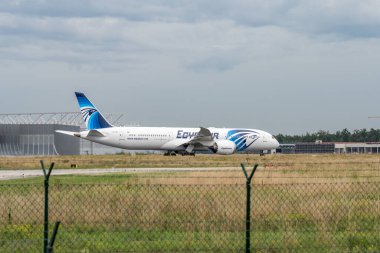 Frankfurt Germany 11.08.19 Egypt Air Boeing 787-9 Dreamliner departure at Fraport Airport SU-GET. clipart