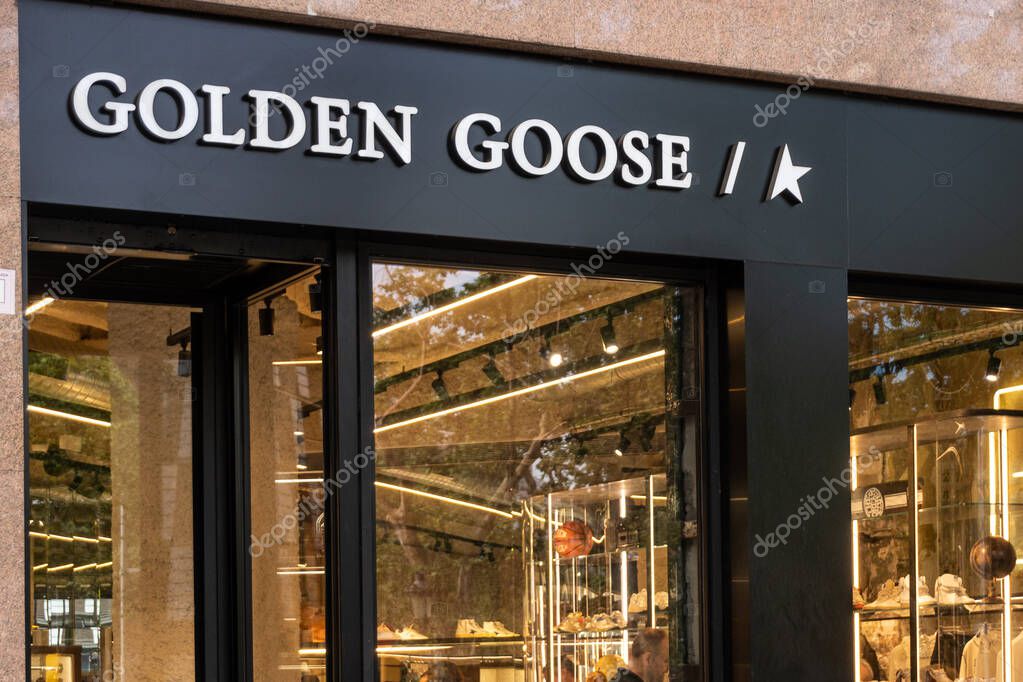 Barcelona, Spain-April 29, 2023. Golden Goose is an Italian high fashion trainer brand based in Venice, Italy. Logo on the front door