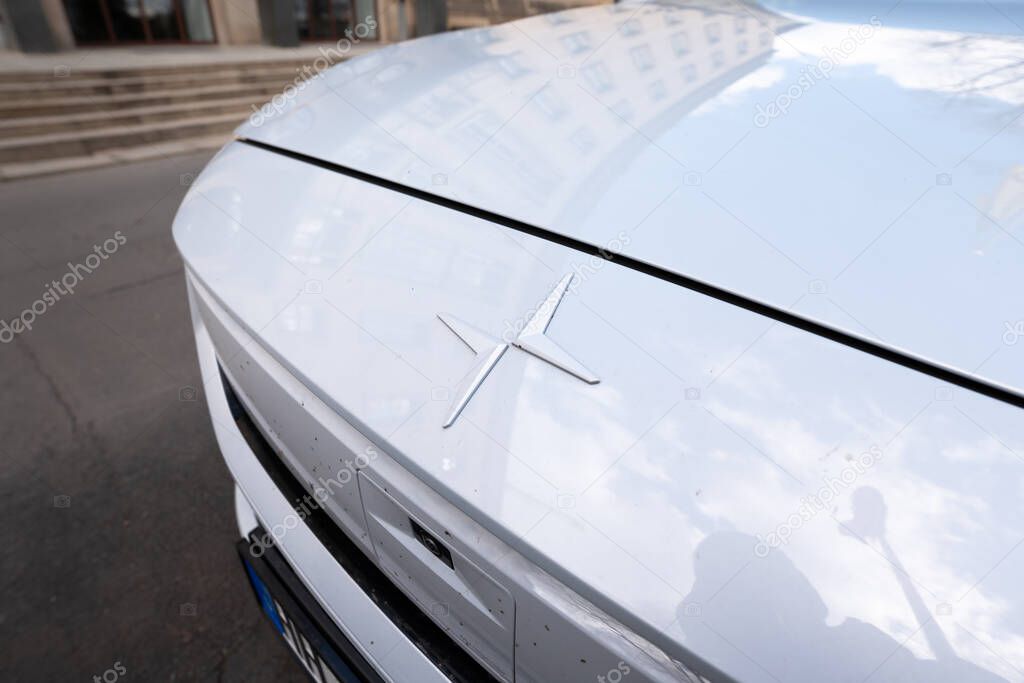 DRESDEN, GERMANY - 12. April 2025: Polestar emblem in a close up view. Brand logo on an electric car exterior. Identity of the technology and automotive company on the hood at the front.