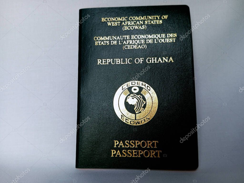 Kumasi, Ghana - February 4, 2025: Front view of green Ghana travelling passport on white background. Document for travelling by air. Ghana is part of Economic Community of West African States (ECOWAS)
