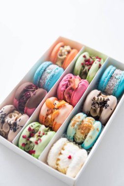 Colourful Dessert. acaroons Tasty. Close-up of different colors macarons cakes of in white background. Culinary and cooking concept.