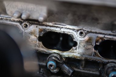 Dirty intake manifold. dirty engine Intake car engine Engine cleaning process the intake manifold. Close up manifold ports. Close up of dirty intake manifold ports. Car repair concept.