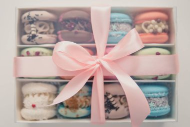 Sweet macaroons macarons French macaroon cake. Minimal food bakery concept. Macaroons in box. Sweet colorful macarons on white background. Tasty macaroons. olorful pink blue yellow green macaron.