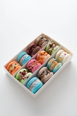 Colourful Dessert. acaroons Tasty. Close-up of different colors macarons cakes of in white background. Culinary and cooking concept.