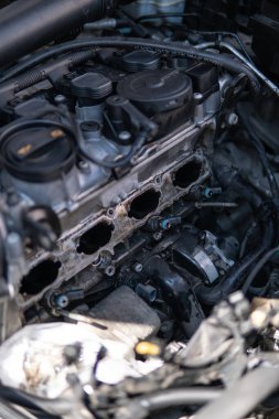 Dirty intake manifold. Close up of dirty intake manifold ports. Engine cleaning process the intake manifold. Car repair concept. dirty engine Intake car engine Close up manifold ports.