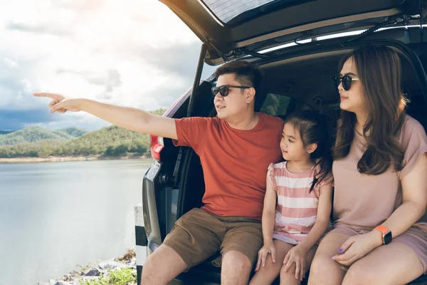 Summer vacations.Happy family enjoying trip with their favorite car. Holiday and travel family concept.