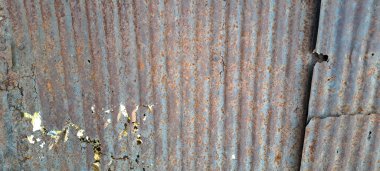 Arka plan için eski çinko vintage duvar dokusu, metal panellerde paslı desen. Teneke çatı kırsal duvar.