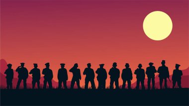 Gün batımının arka planında bir grup insanın silueti.