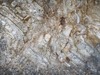Kaya yüzeyini şekillendiren doğal taş katmanları jeolojik, doğa ya da soyut arkaplanlar ve yaratıcı tasarımlar için mükemmeldir..