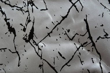 Kapalı kapaklı yapay gümüş rengi ve doku arka planı için siyah desenli. en üstteki görünüm