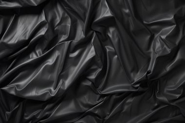 Siyah selofan çöp torbası dokusunun işlenmiş kolajı. Pankart, arkaplan veya 3B haritalama için doku