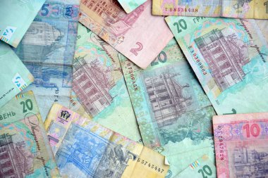 Ukrayna 'nın işlenmiş Hryvnia UAH kolajı banknotların dokusunu destekler. Pankart, arkaplan veya 3B haritalama için doku