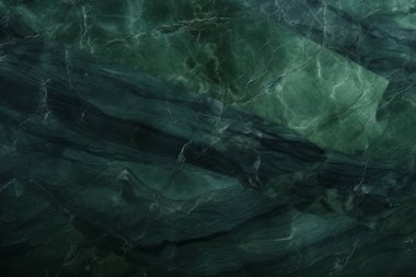 İşlenmiş kolaj, koyu yeşil parlak mermer dokular. Pankart, arkaplan veya 3B haritalama için doku