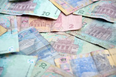 Ukrayna 'nın işlenmiş Hryvnia UAH kolajı banknotların dokusunu destekler. Pankart, arkaplan veya 3B haritalama için doku