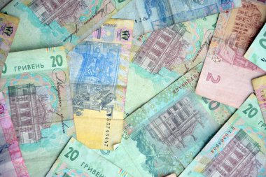 Ukrayna 'nın işlenmiş Hryvnia UAH kolajı banknotların dokusunu destekler. Pankart, arkaplan veya 3B haritalama için doku