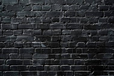 Eski tuğla duvarın resmi siyah renge boyanmış. Yakın plan. Arkaplan veya haritalama için arkaplan dokusu