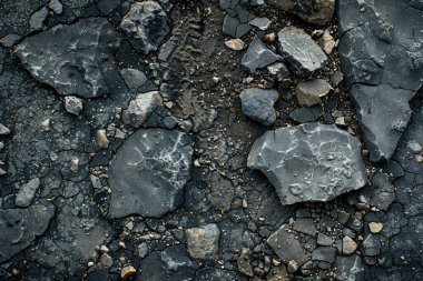 Gri asfalt kaya döküntülerinin fotoğrafı. Arkaplan veya haritalama için arkaplan dokusu