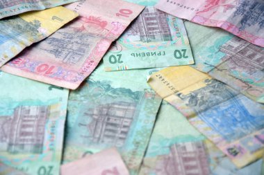 Ukrayna 'nın işlenmiş Hryvnia UAH kolajı banknotların dokusunu destekler. Pankart, arkaplan veya 3B haritalama için doku